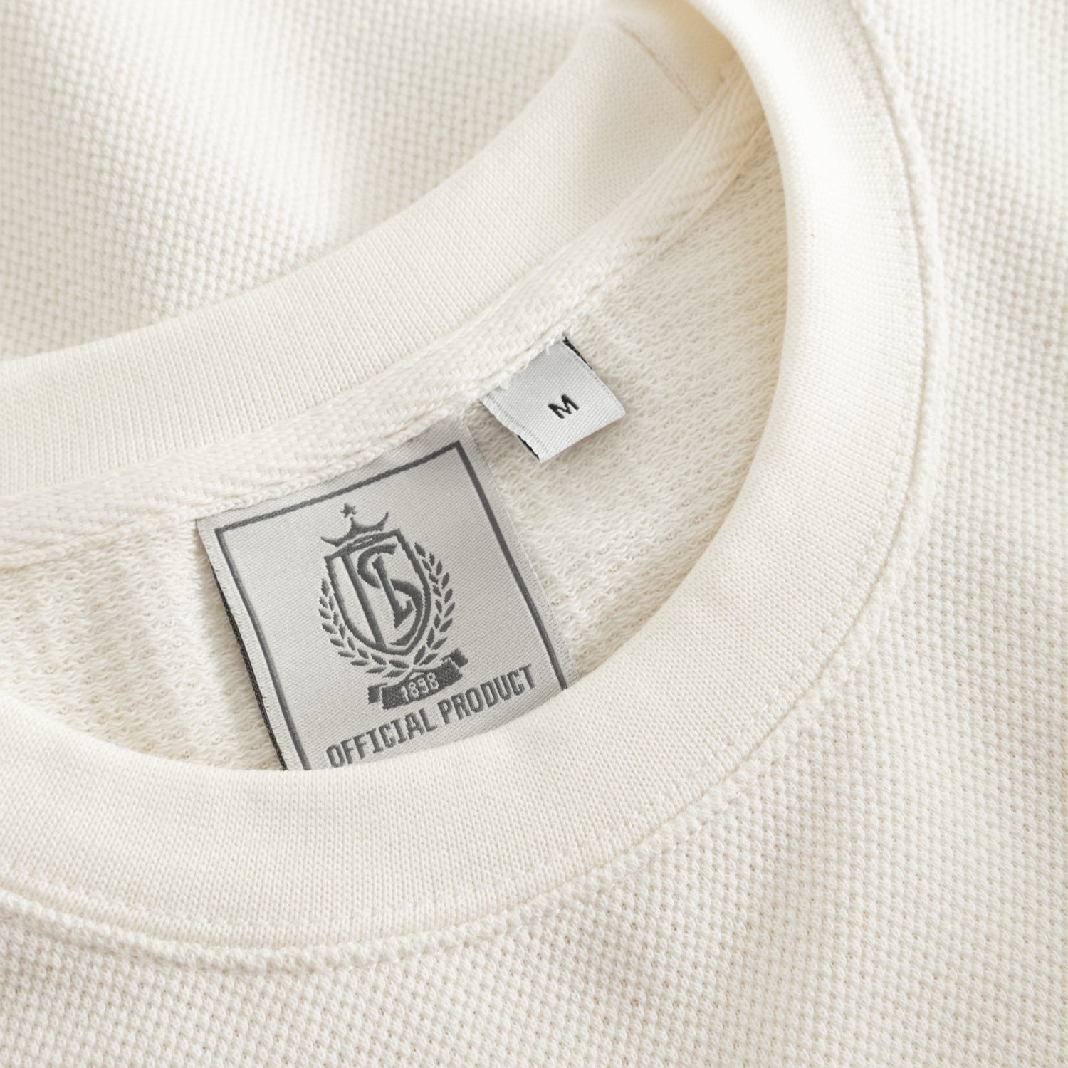 PULL PIQUE BLANC BLASON ROUGE